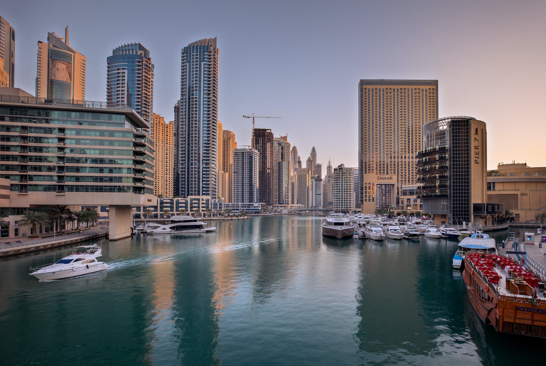 Boating quay in the fore ground with modern cityscape in the background. 
