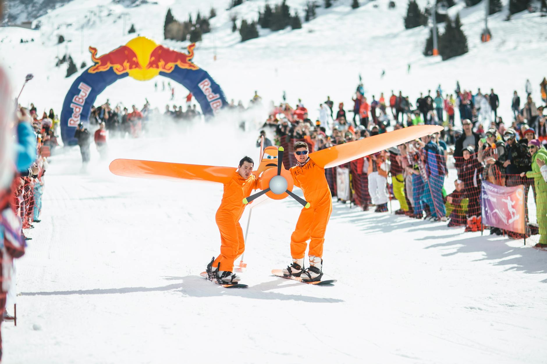 Mountain skiing competition with the Red Bull Finishing Arch in the background.